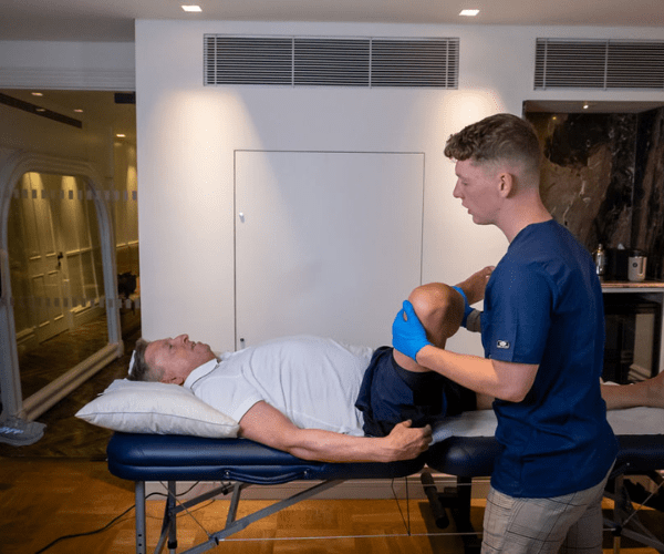Patient receiving physio for hip pain from a recurring sports injury